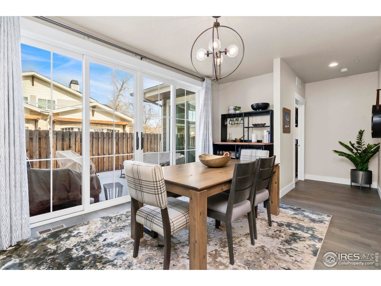 910 Hill Pond Road, Unit 15 Fort Collins, CO 80526 - Photo 20 of 43 a view of a dining room with furniture window and wooden floor
