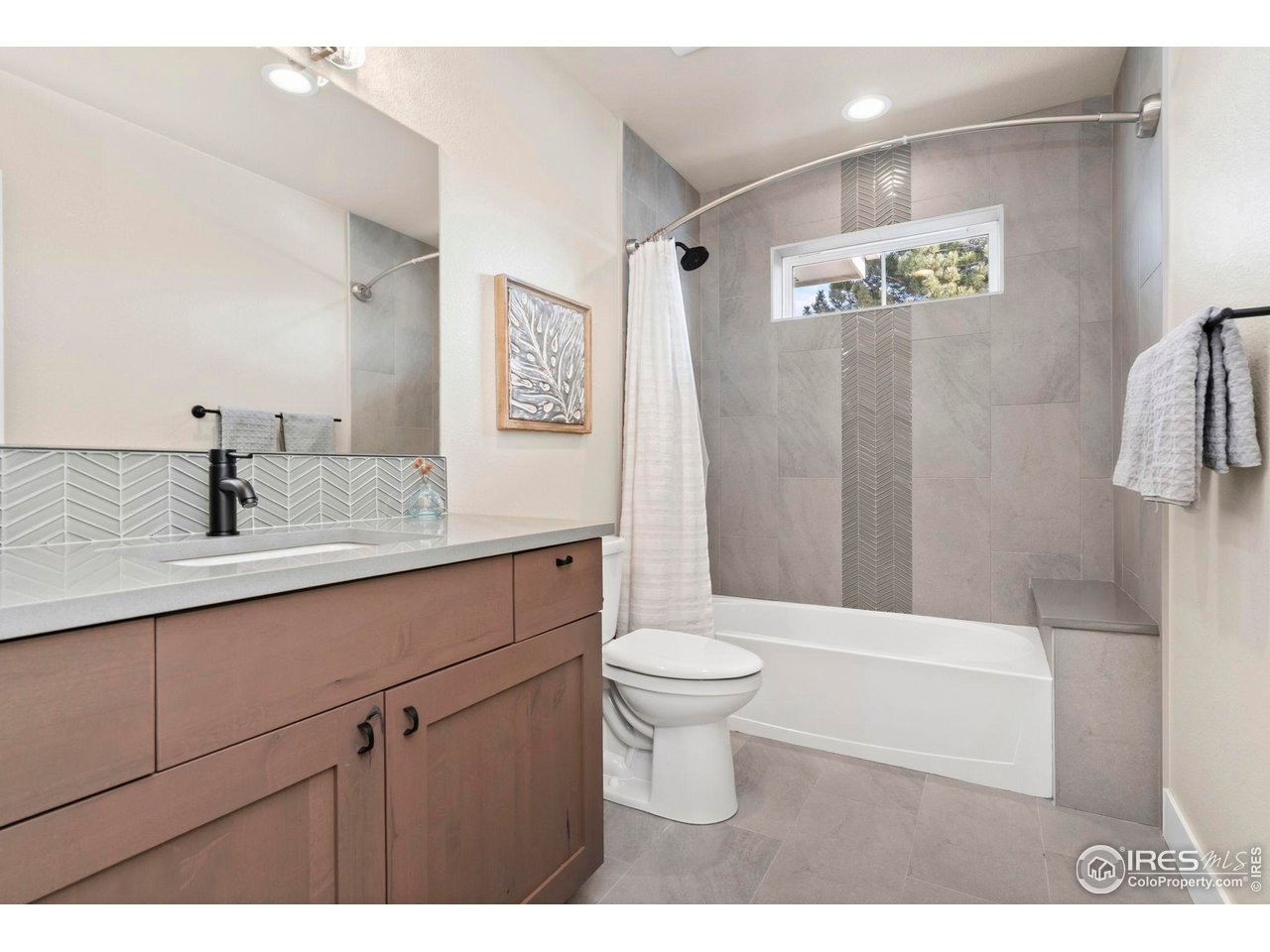 910 Hill Pond Road, Unit 15 Fort Collins, CO 80526 - Photo 25 of 43 a bathroom with a sink a toilet and shower