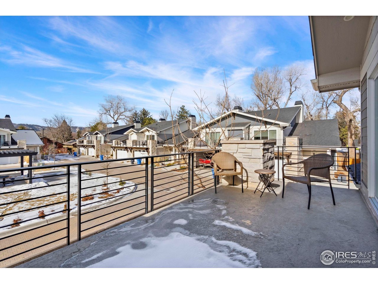 910 Hill Pond Road, Unit 15 Fort Collins, CO 80526 - Photo 31 of 43 a view of a terrace with chairs