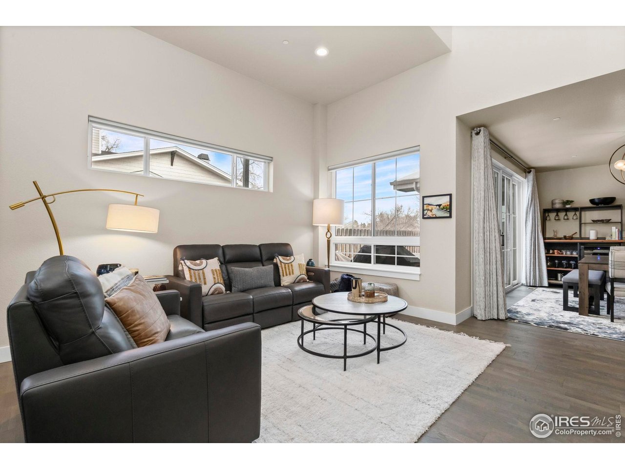 910 Hill Pond Road, Unit 15 Fort Collins, CO 80526 - Photo 6 of 43 a living room with furniture and a wooden floor