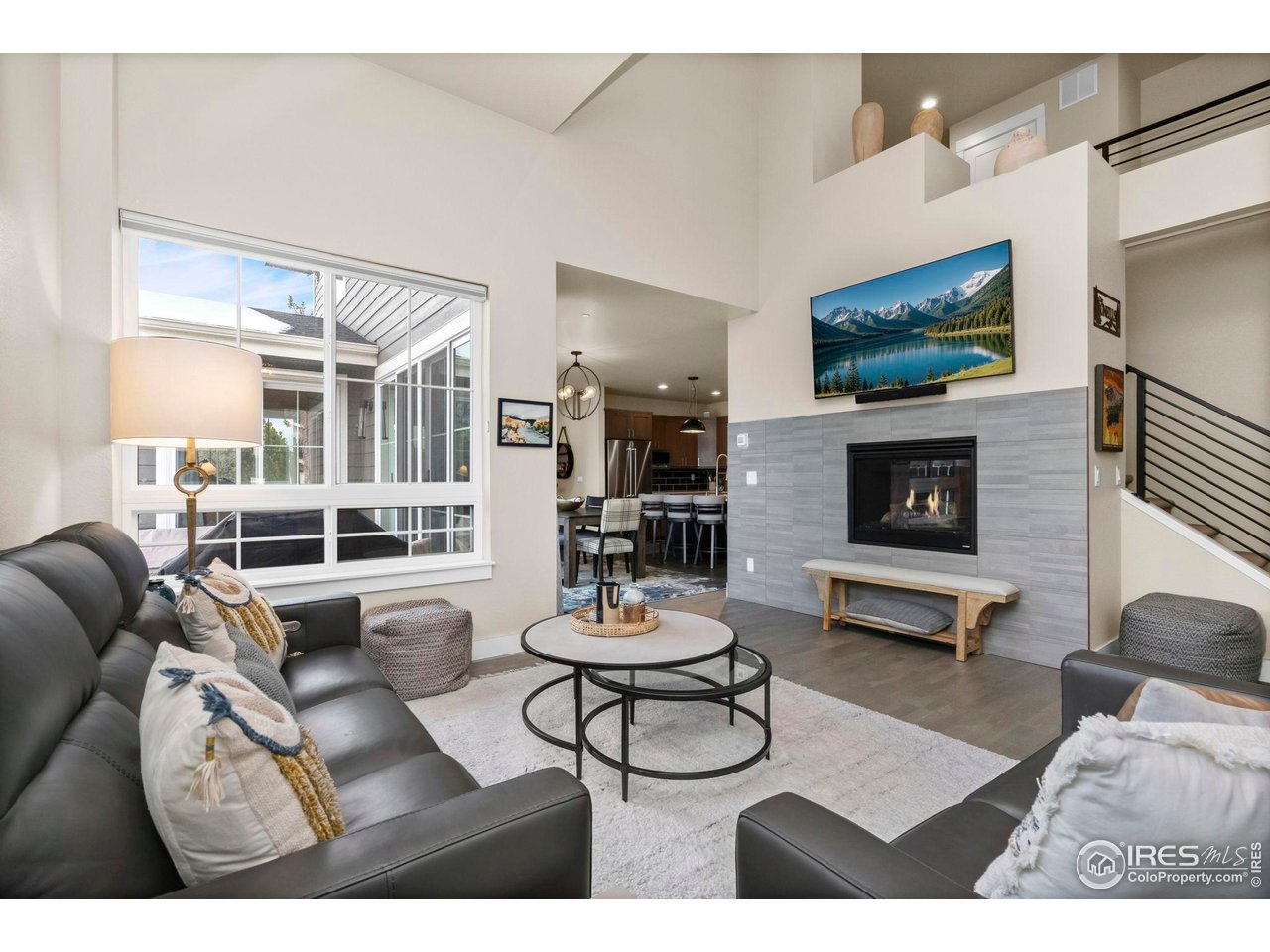 910 Hill Pond Road, Unit 15 Fort Collins, CO 80526 - Photo 7 of 43 a living room with furniture a flat screen tv and a fireplace