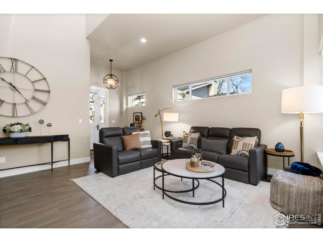 910 Hill Pond Road, Unit 15 Fort Collins, CO 80526 - Photo 8 of 43 a living room with furniture a rug and a lamp