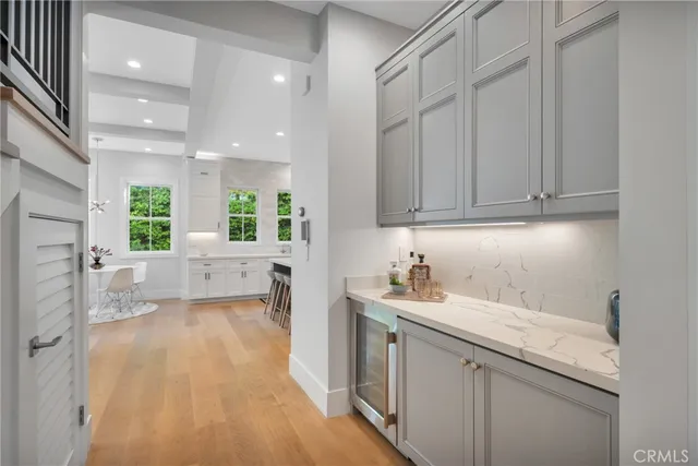 a view of a patio with table and chairs and potted plants