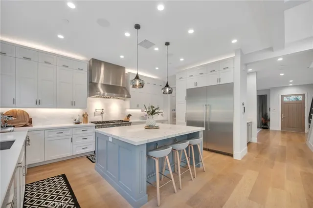 a view of backyard with table and chairs and potted plants