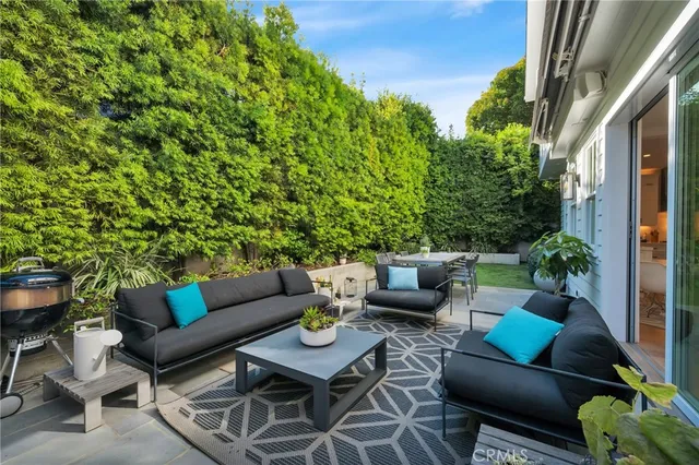 a bathroom with a granite countertop sink toilet a mirror a vanity and shower