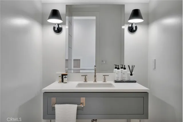 a bedroom with a bed and a mirror