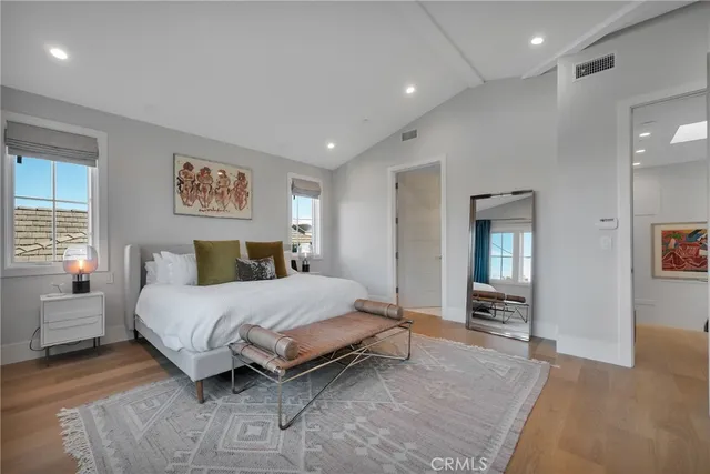 a bedroom with a bed and a couch