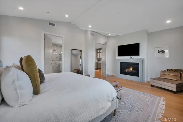 a bathroom with a granite countertop sink toilet a mirror and shower
