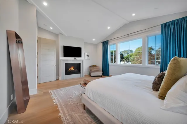 a view of staircase with lots of frames on wall and a window