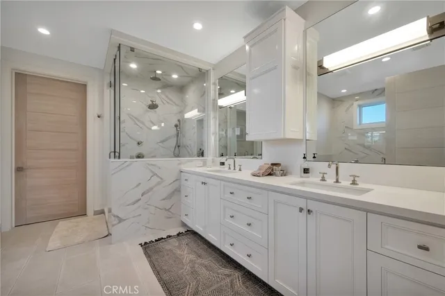 a view of a kitchen with white cabinets
