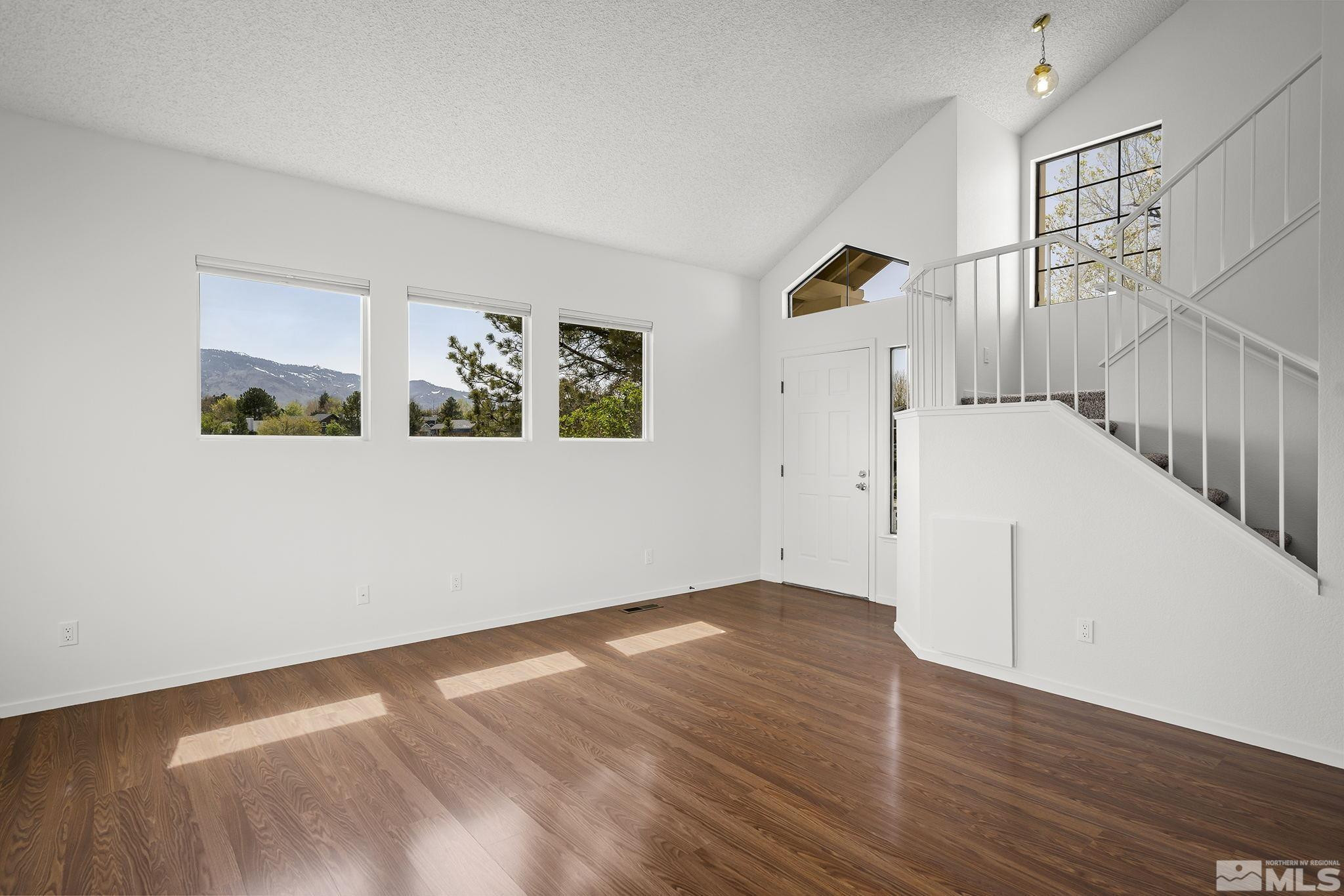 1178 Backer Way Reno, NV 89523 - Photo 7 of 39 a view of a room with wooden floor and white walls