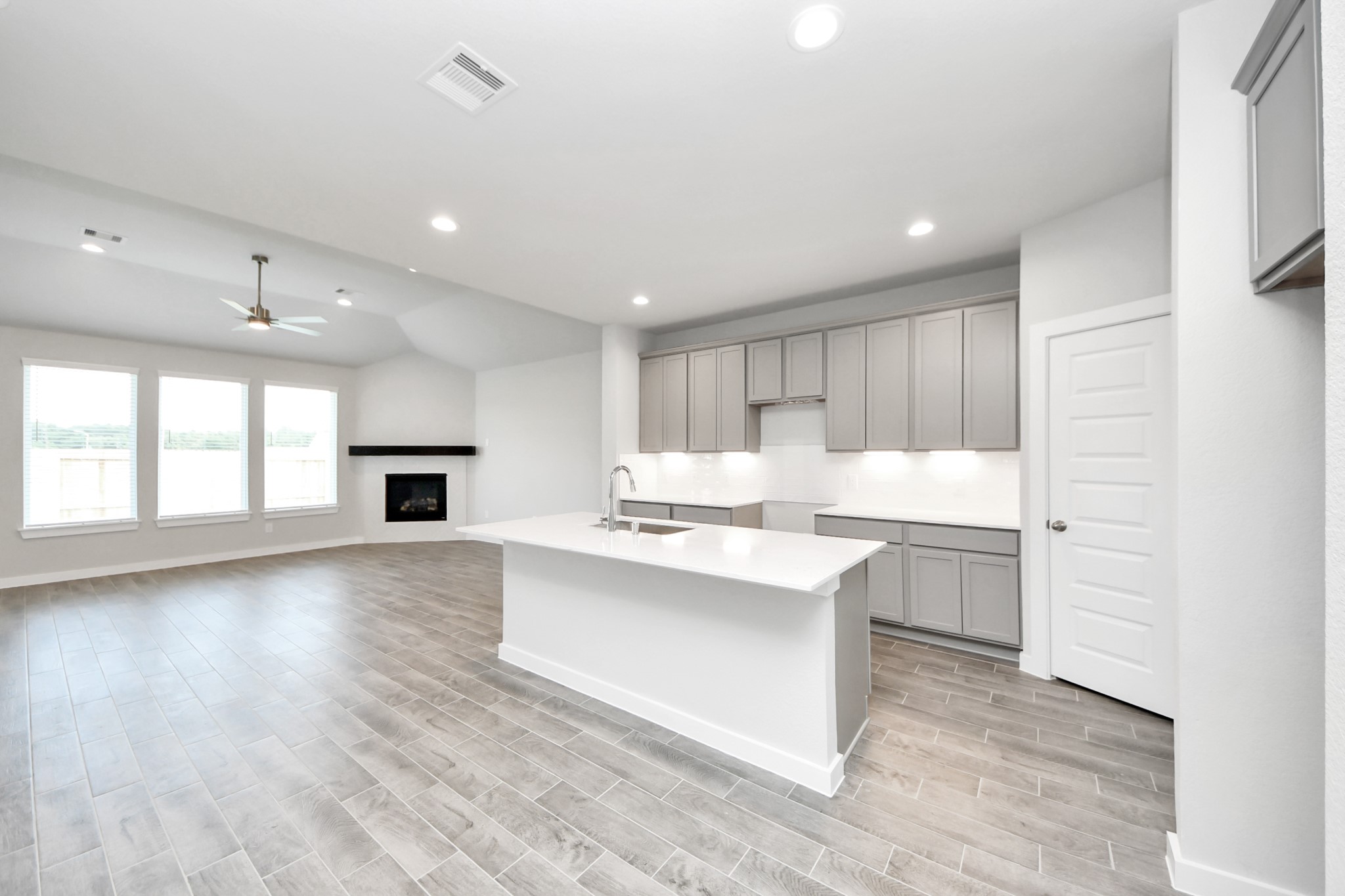 24502 Broad Park Spring, TX 77373 - Photo 15 of 47 The kitchen is a culinary haven, featuring granite countertops, a tile backsplash, stainless steel appliances, 42” upper cabinets, and undercabinet lighting.