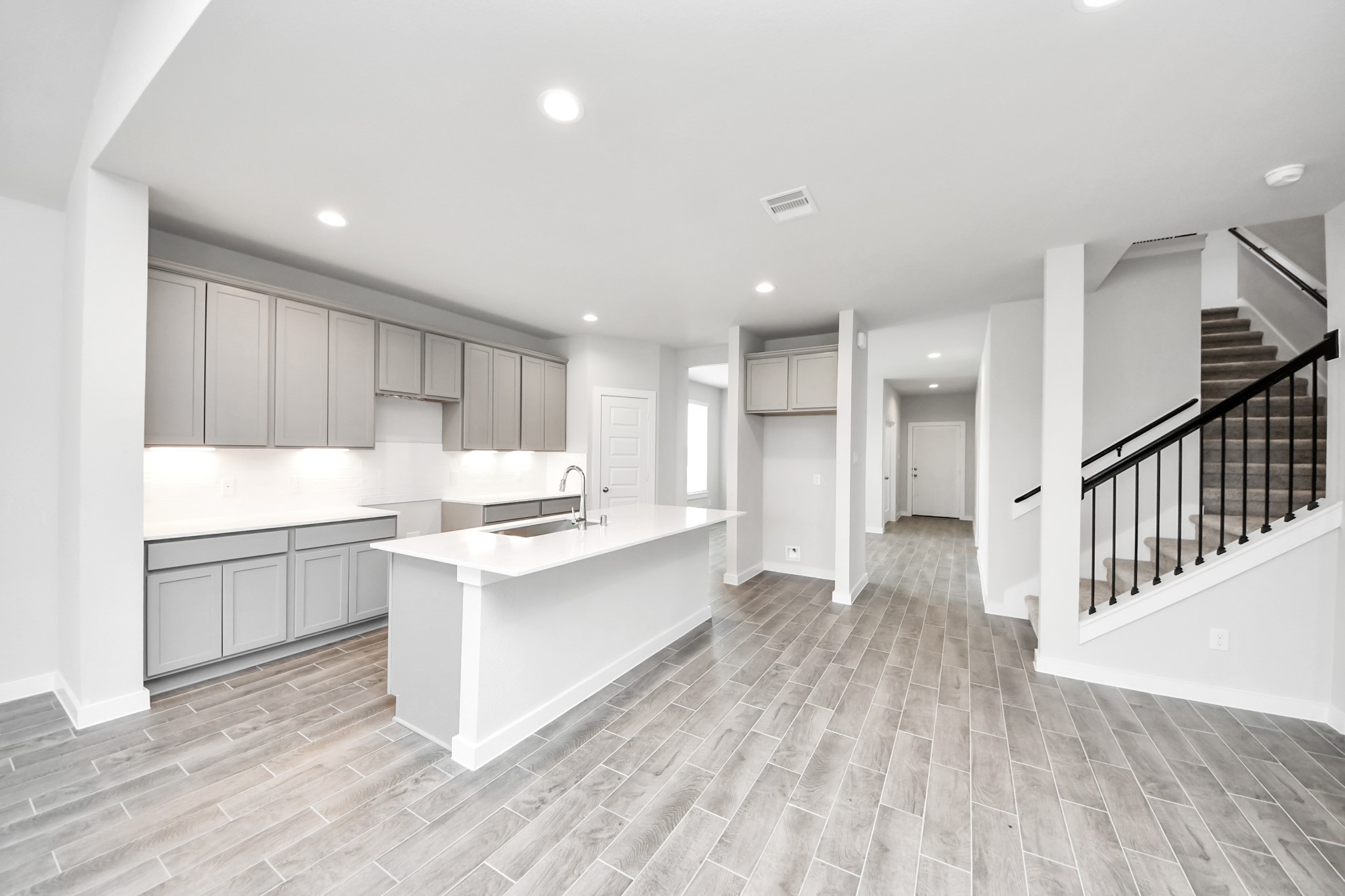 24502 Broad Park Spring, TX 77373 - Photo 16 of 47 This kitchen is by far any chef’s dream! This spacious kitchen features high ceilings, light stained wood cabinets, granite countertop, SS appliances, modern tile backsplash, recessed lighting, extended counter space, granite kitchen island with double sink, and space for breakfast bar, and a walk-in pantry all overlooking your huge family room.