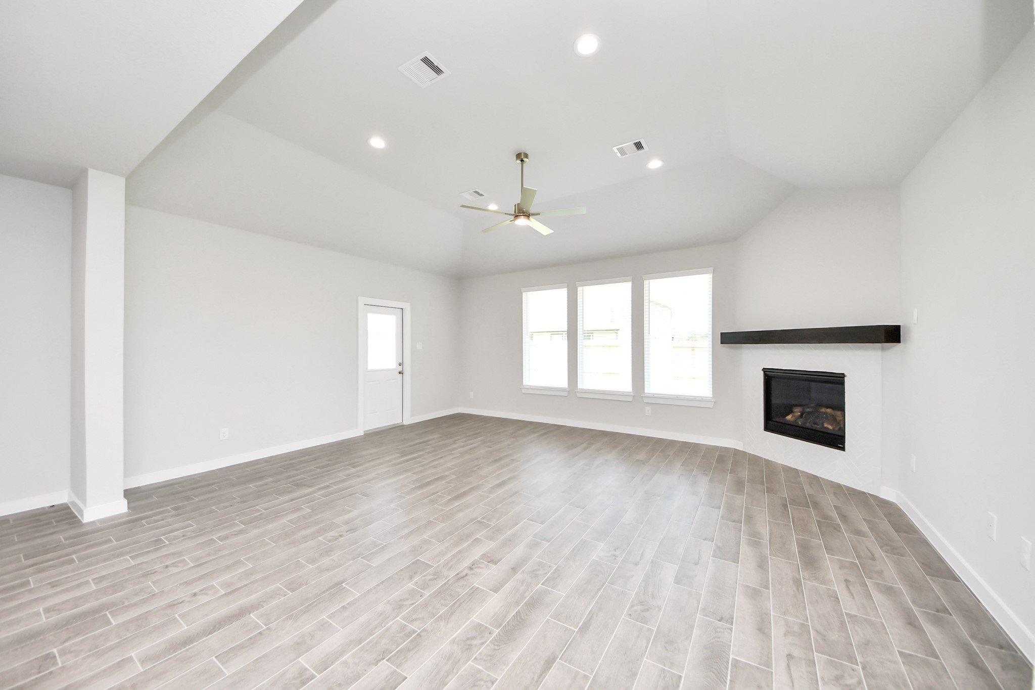24502 Broad Park Spring, TX 77373 - Photo 23 of 47 Gather the family and guests together in your lovely living room! Featuring soaring high ceilings, recessed lighting, ceiling fan, custom paint, gorgeous floors, and large windows that provide plenty of natural lighting throughout the day.