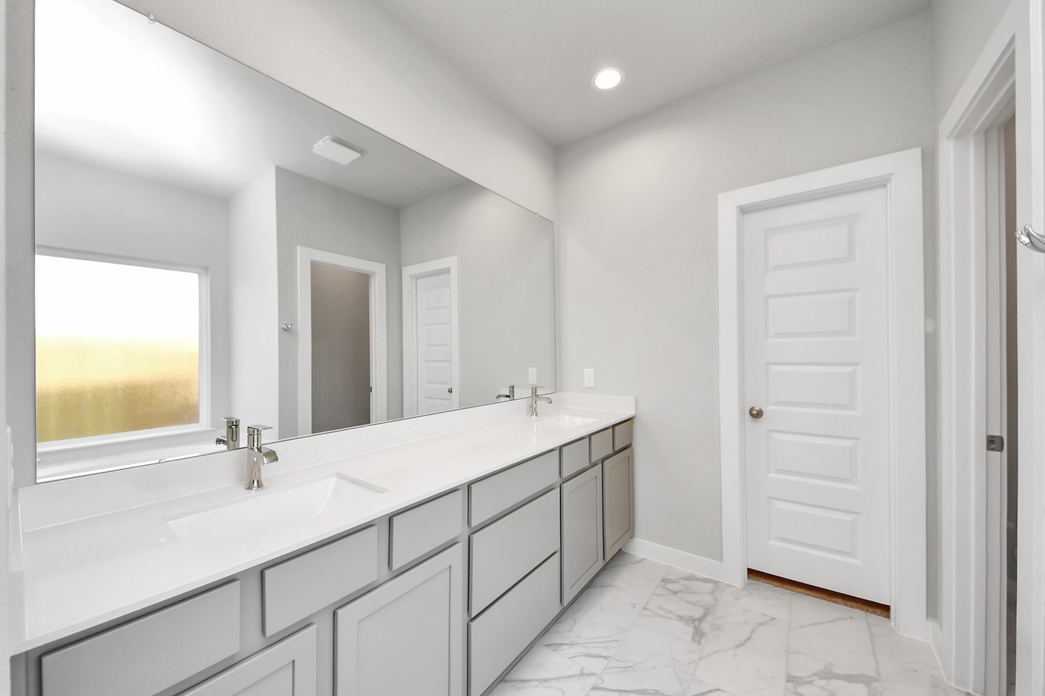 24502 Broad Park Spring, TX 77373 - Photo 29 of 47 Escape to a spa-like oasis in this primary bathroom. Enjoy a walk-in shower with tile surround, a separate garden tub with custom detailing, and an elegant vanity featuring light countertops, modern hardware, and beautiful recessed lights. Experience luxury and relaxation in every detail.