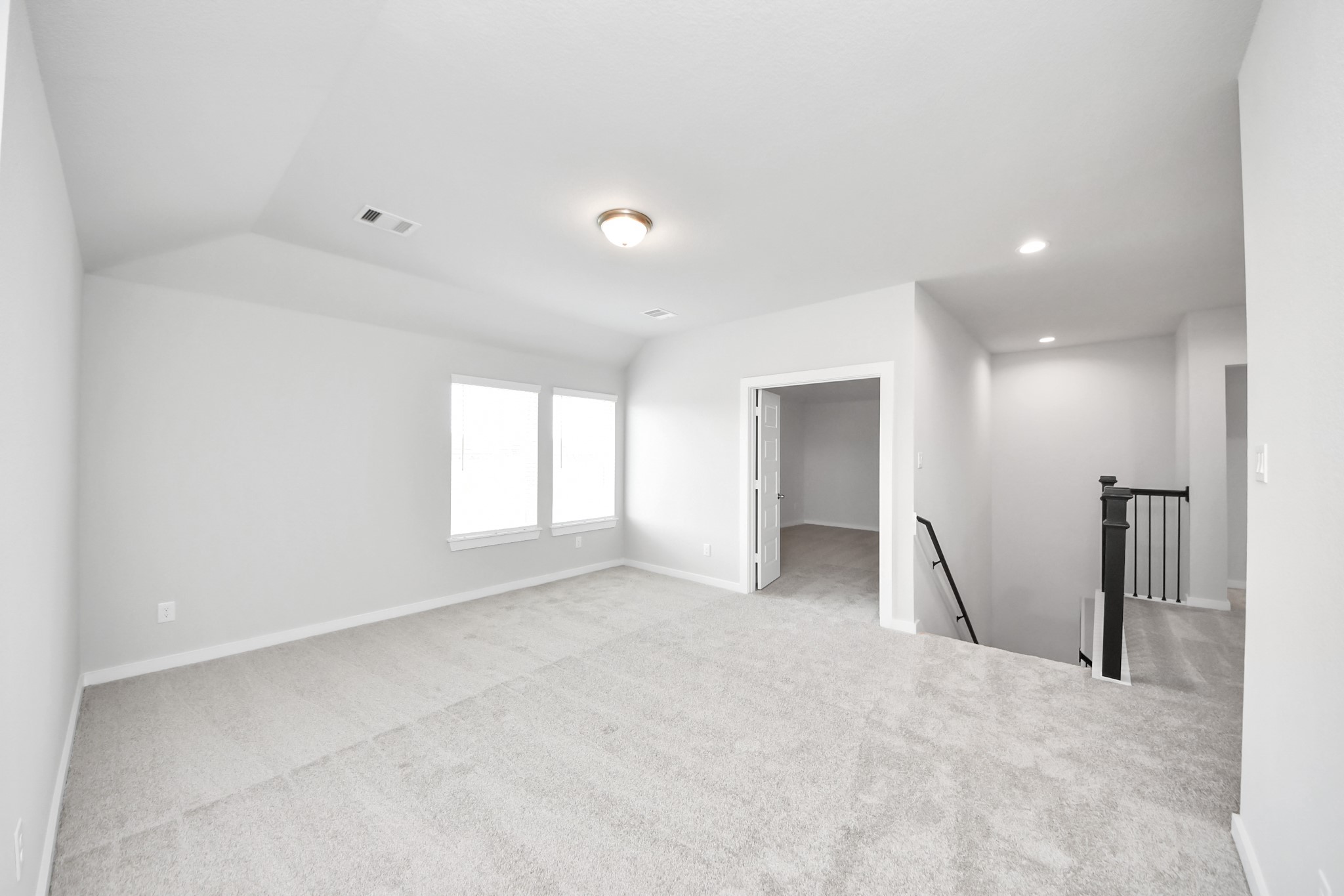 24502 Broad Park Spring, TX 77373 - Photo 35 of 47 Come upstairs and relish a day of relaxation in this loft area! Ideal as an additional living space or game room, it boasts plush carpeting, high ceilings, custom paint, and windows that flood the area with abundant natural light.