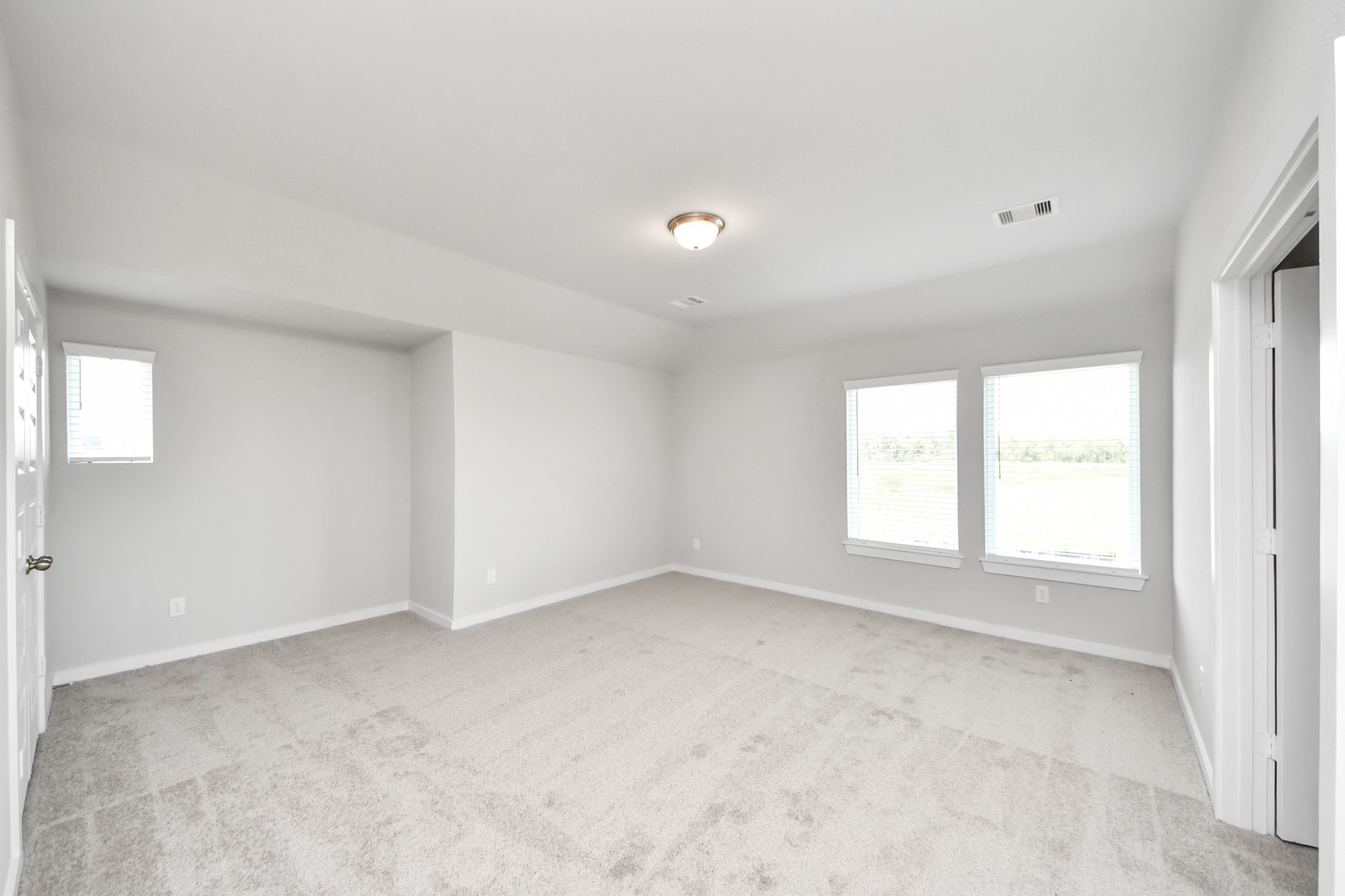 24502 Broad Park Spring, TX 77373 - Photo 36 of 47 Come upstairs and enjoy a day of leisure in this fabulous game room! This is the perfect hangout spot or adult game room! Features plush carpet, high ceilings, custom paint and windows for plenty of natural light.