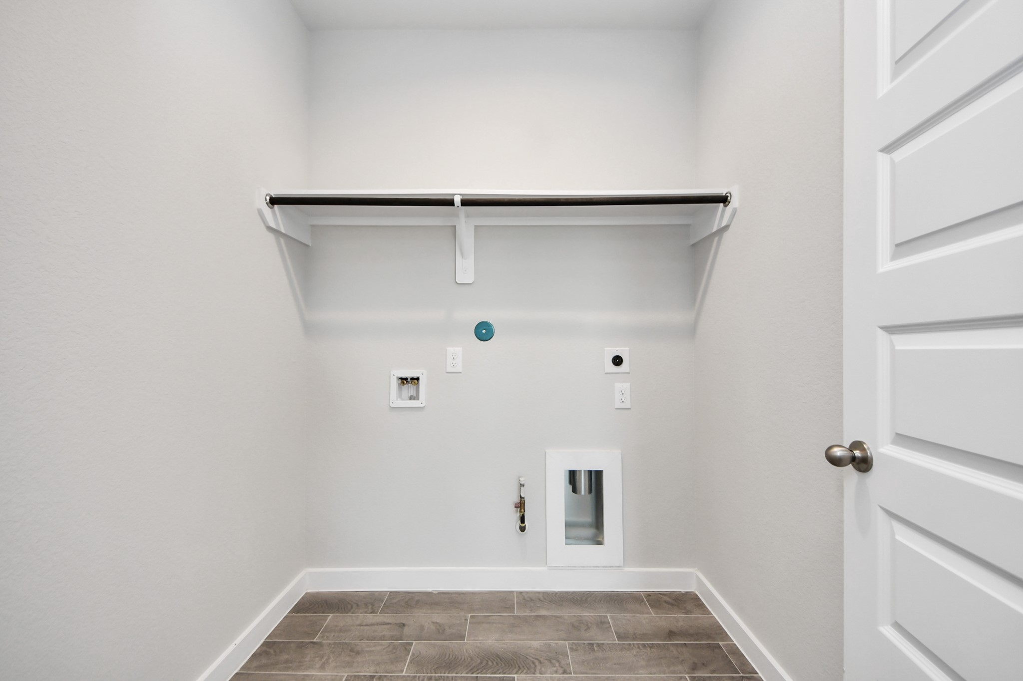 24502 Broad Park Spring, TX 77373 - Photo 42 of 47 A perfect blend of functionality and comfort. Capture the essence of easy living with a first-floor laundry room, thoughtfully equipped with shelving for effortless organization. Both electric and gas connections available.