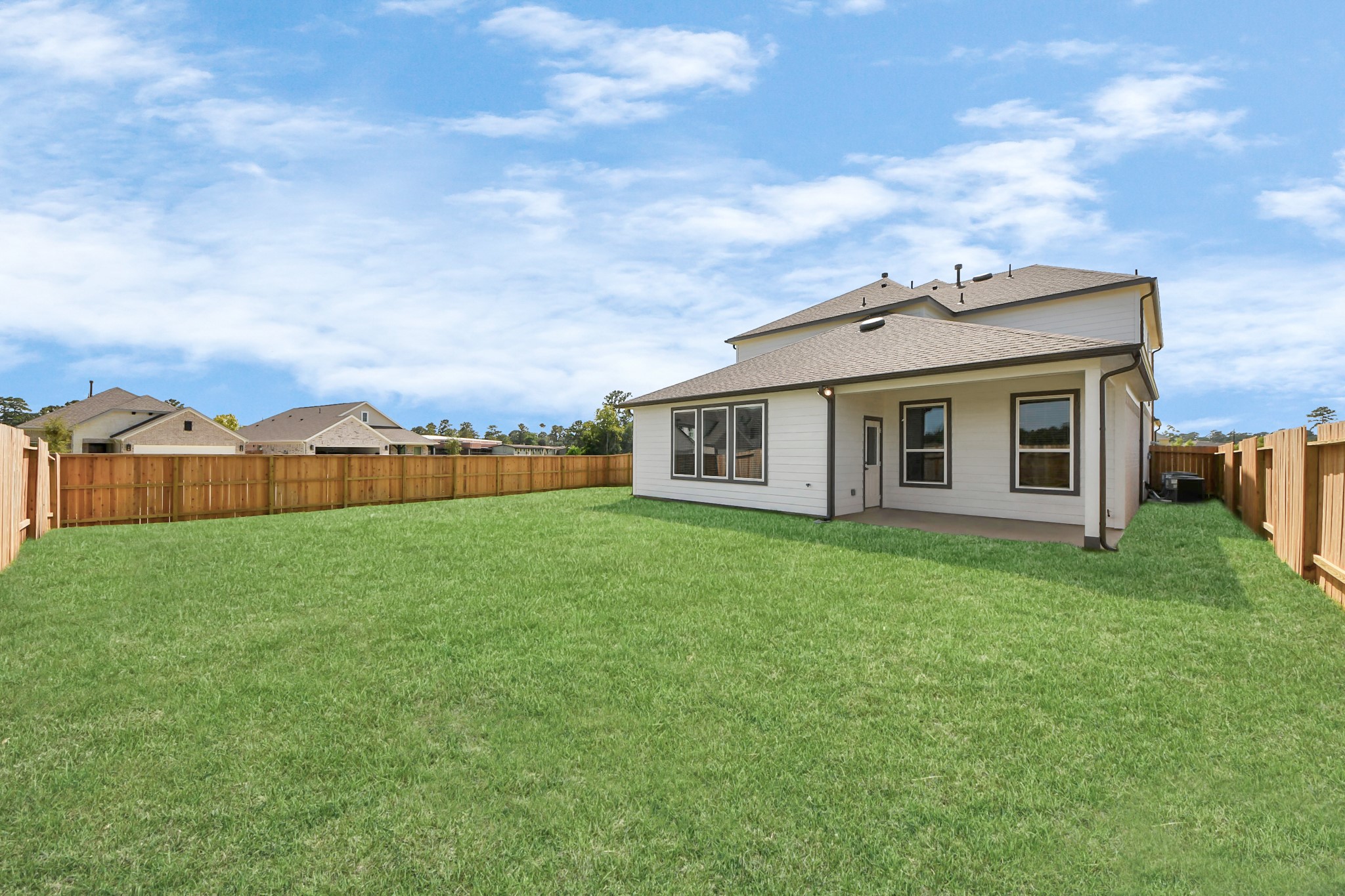 24502 Broad Park Spring, TX 77373 - Photo 44 of 47 Experience outdoor living at its finest on this expansive covered patio, thoughtfully designed for BBQs and delightful outdoor dining.