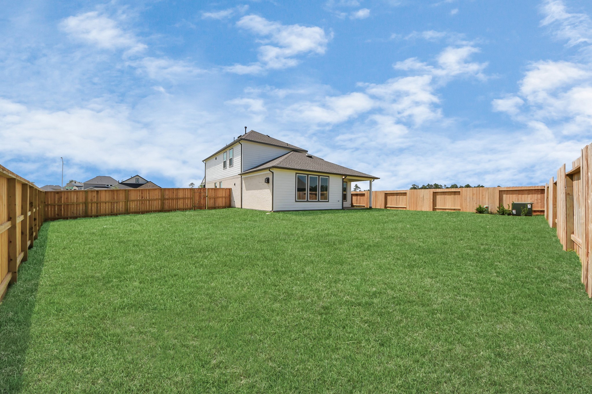 24502 Broad Park Spring, TX 77373 - Photo 45 of 47 Backyard retreat, offering an abundance of space for kids to play and explore. The possibilities are endless in this outdoor haven, where the joy of open-air activities and family gatherings awaits.