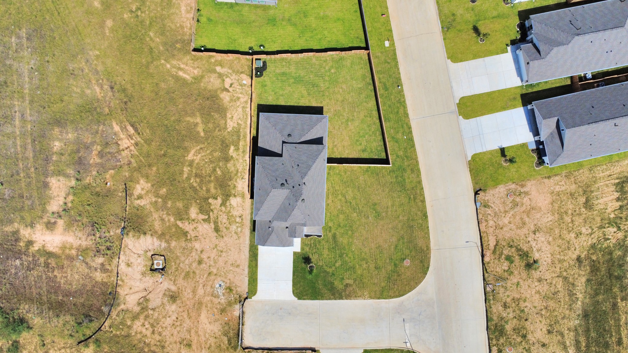 24502 Broad Park Spring, TX 77373 - Photo 5 of 47 An aerial view of a spacious subdivision lot, highlighting a well-maintained yard and a fully fenced perimeter, offering both privacy and expansive outdoor space.