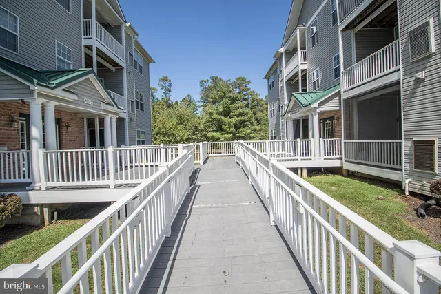 a view of front door and wooden wall