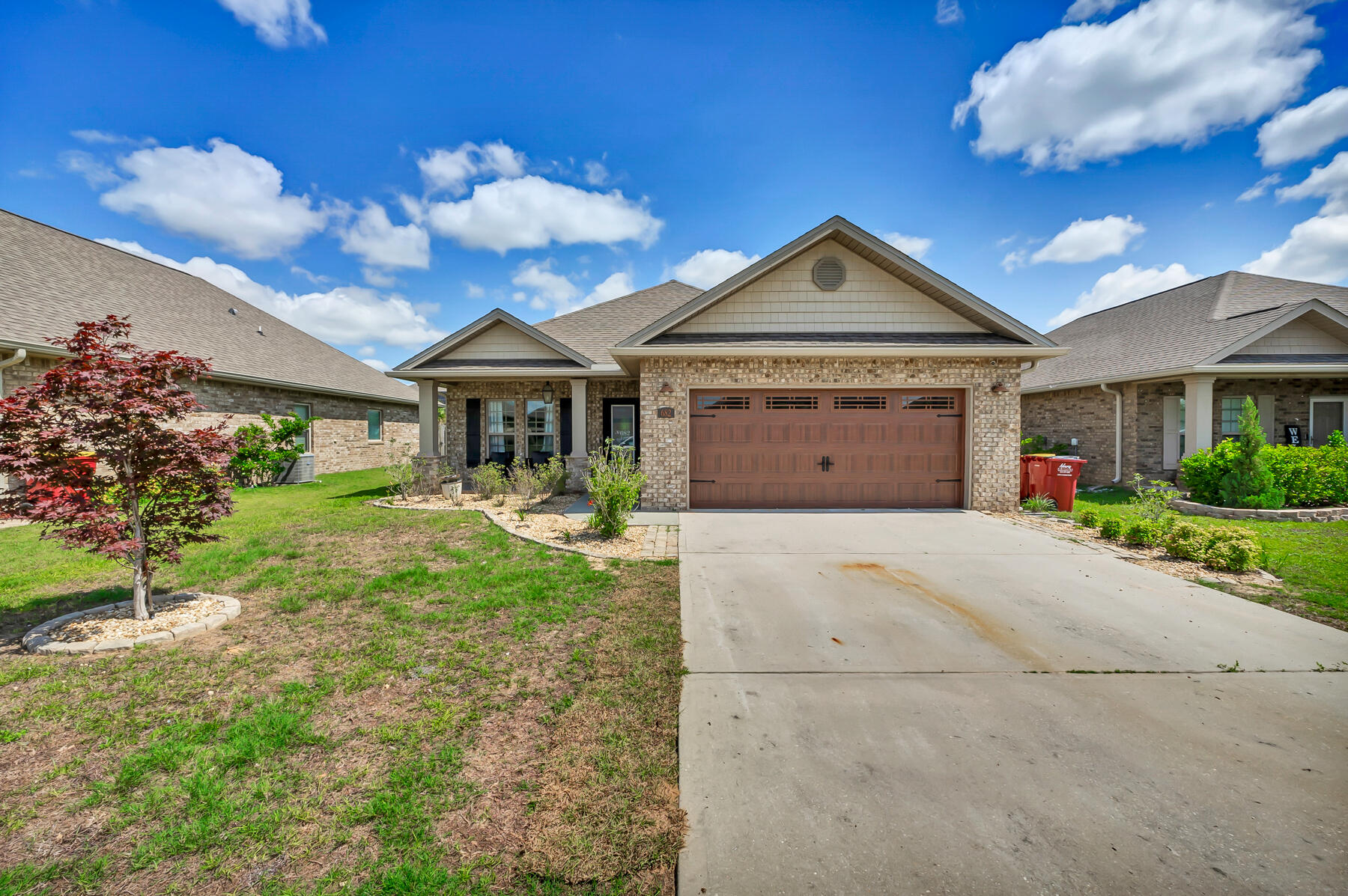 682 Teal Street Crestview, FL 32539 - Photo 1 of 34 a view of a house with yard and a garden