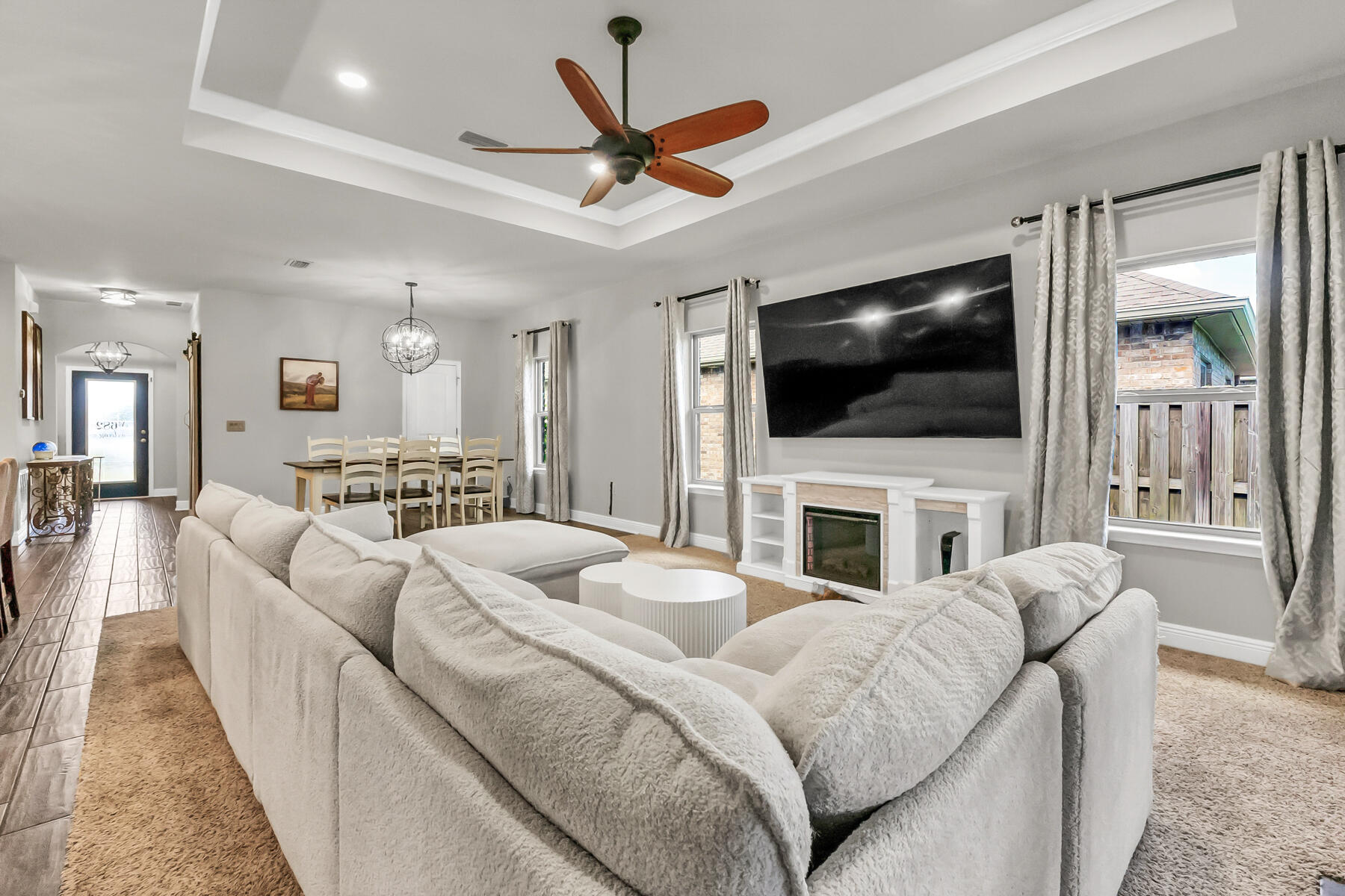 682 Teal Street Crestview, FL 32539 - Photo 11 of 34 a living room with furniture and a flat screen tv