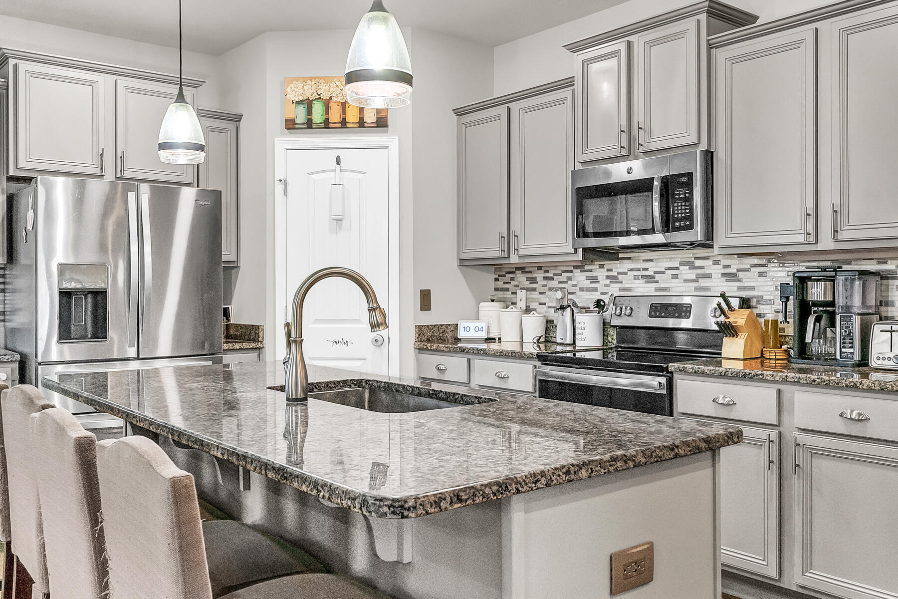 682 Teal Street Crestview, FL 32539 - Photo 12 of 34 a kitchen with stainless steel appliances granite countertop a sink stove and refrigerator
