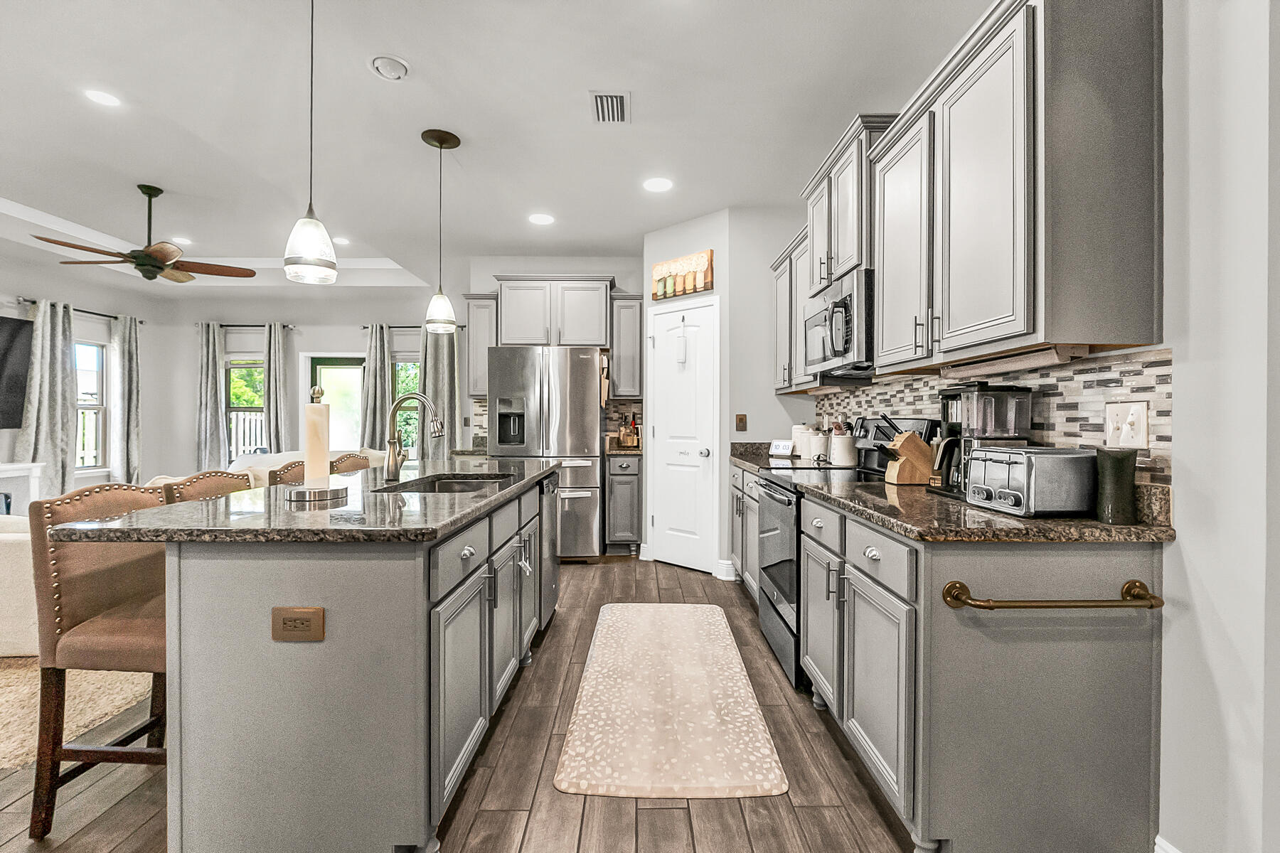682 Teal Street Crestview, FL 32539 - Photo 13 of 34 a kitchen with stainless steel appliances granite countertop sink stove and refrigerator