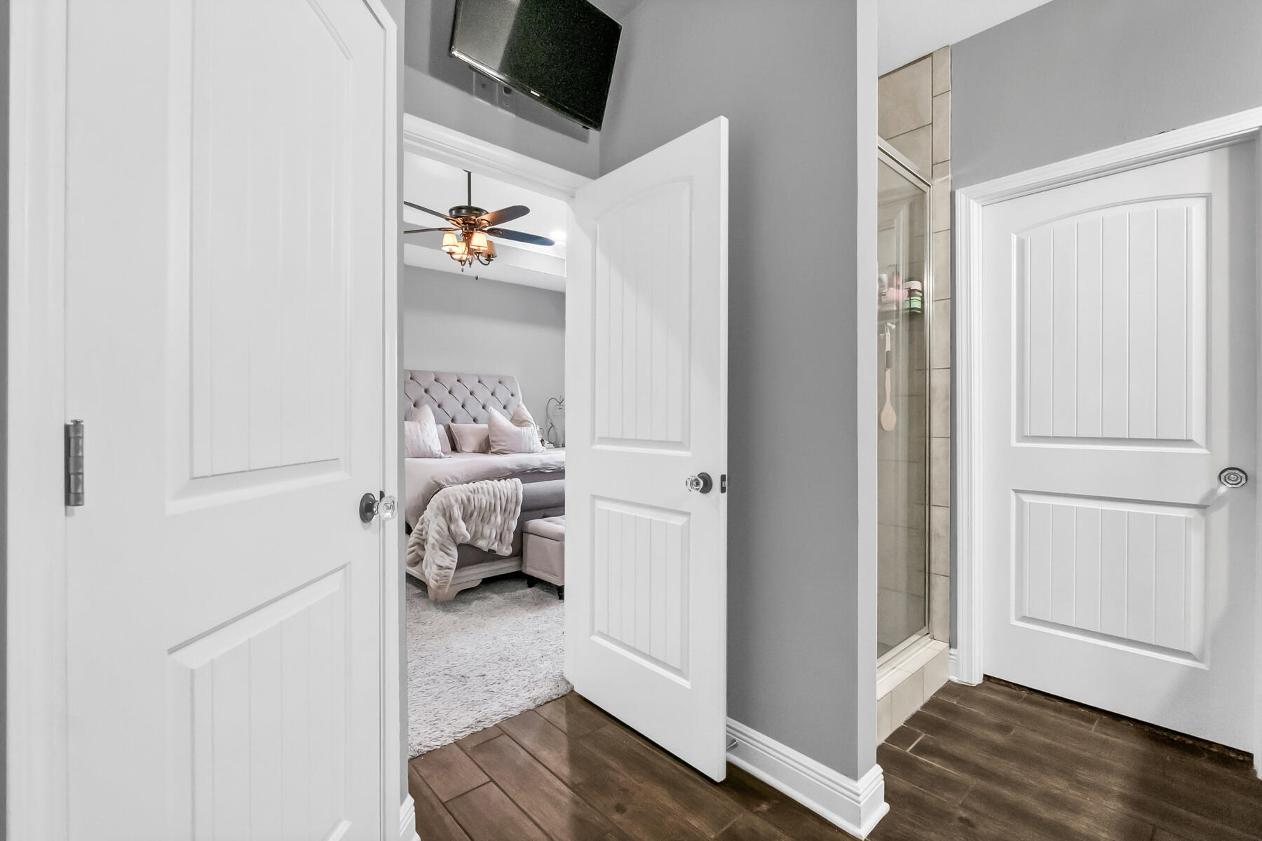 682 Teal Street Crestview, FL 32539 - Photo 16 of 34 a bedroom with a bed and wooden floor