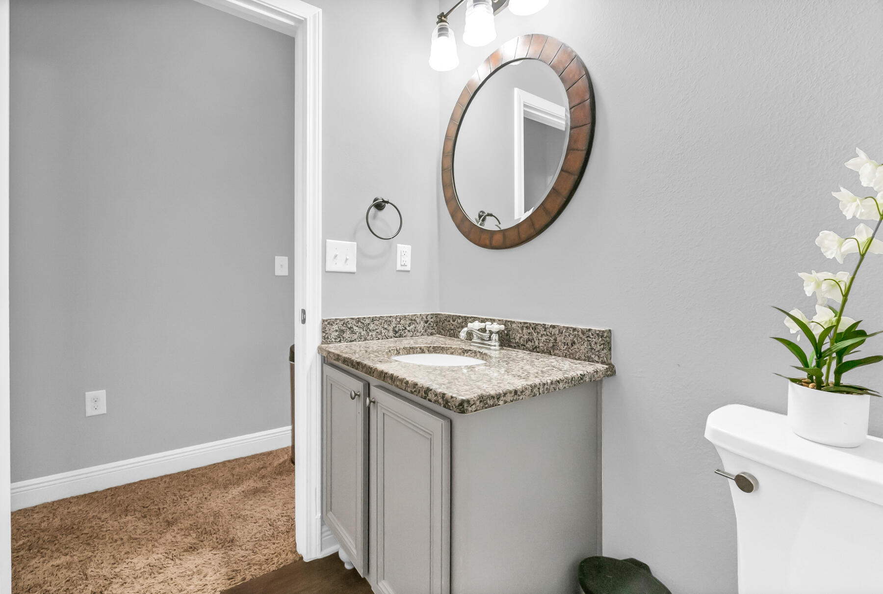 682 Teal Street Crestview, FL 32539 - Photo 18 of 34 a bathroom with a granite countertop sink and a mirror