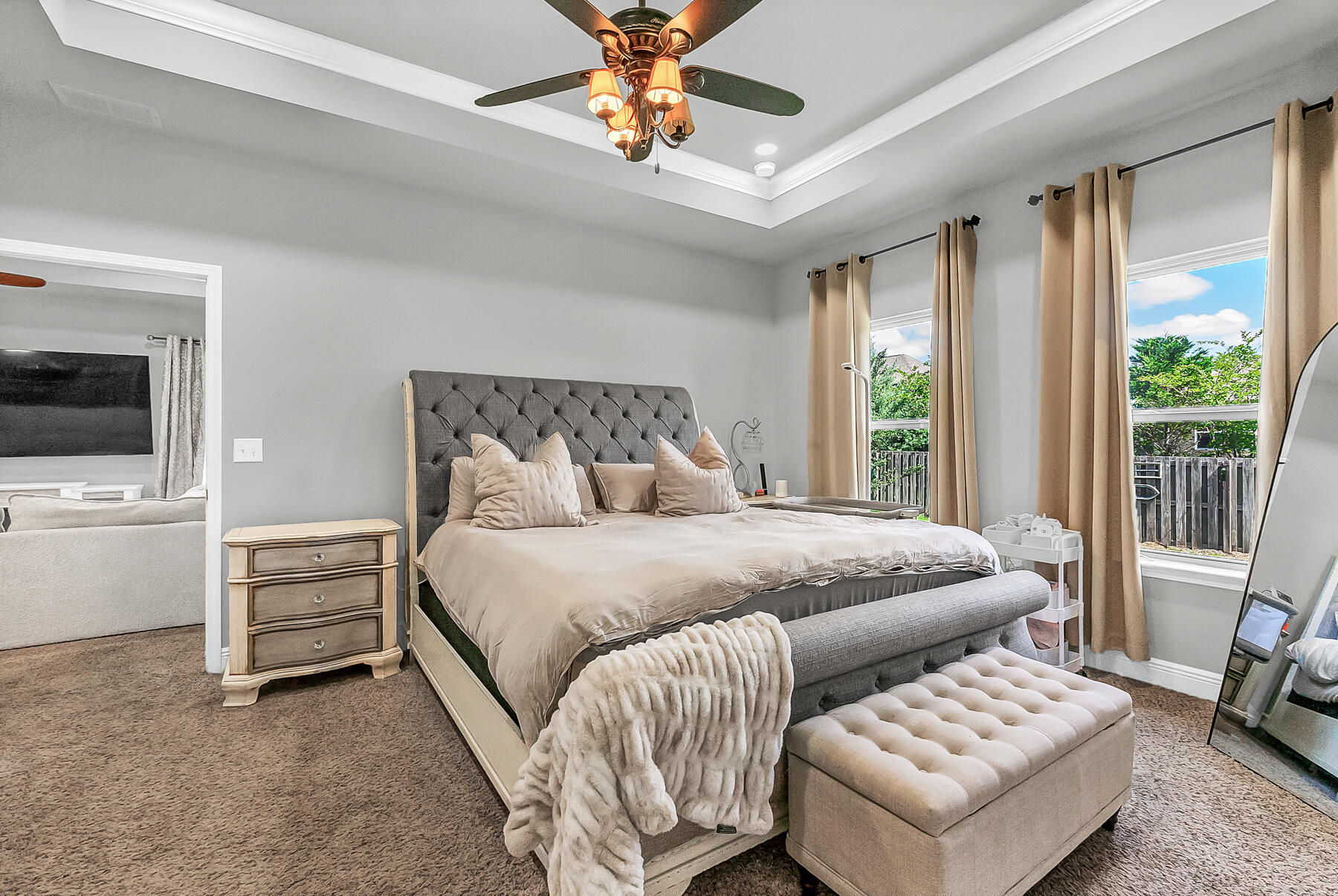 682 Teal Street Crestview, FL 32539 - Photo 23 of 34 a bedroom with a bed and a chandelier