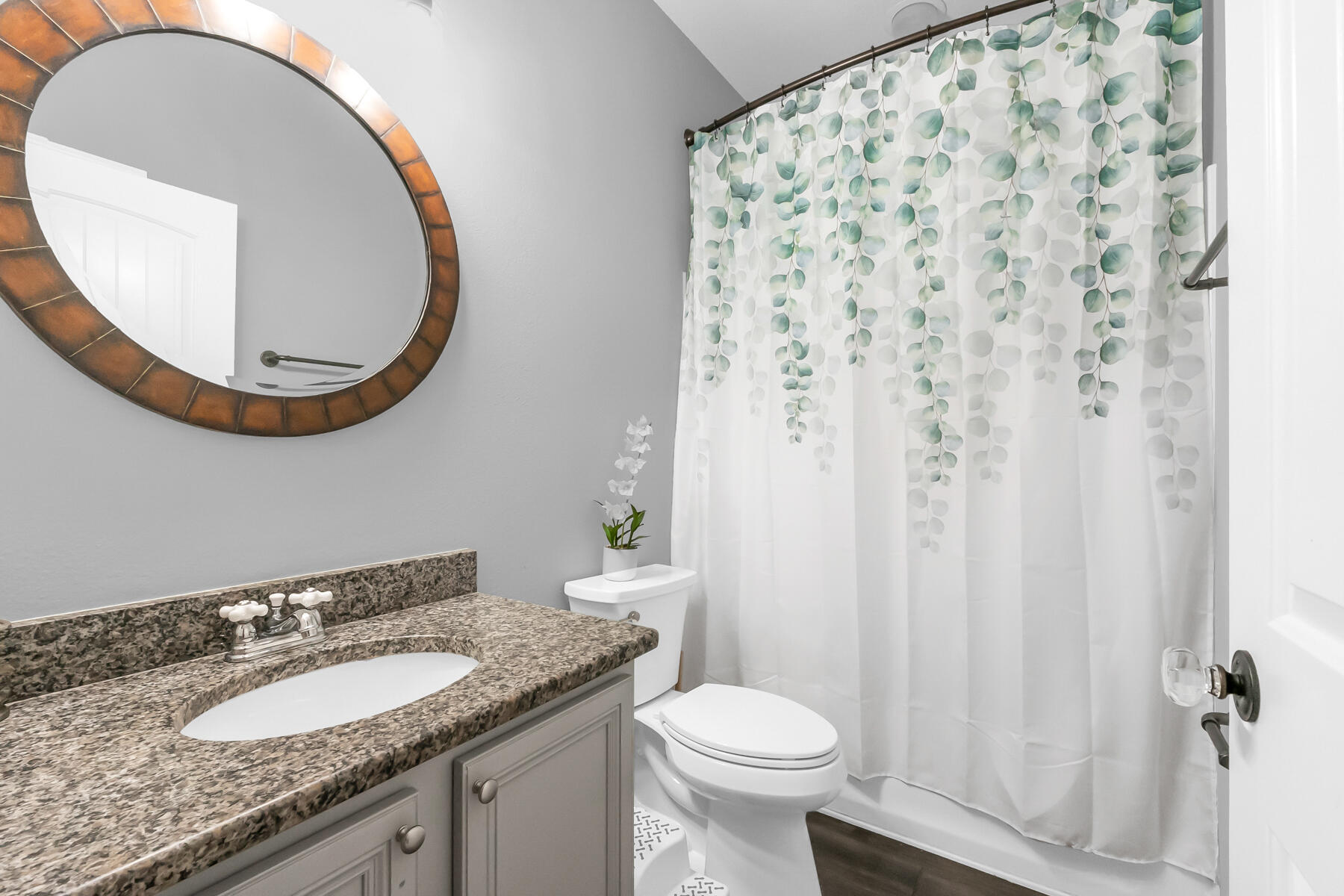 682 Teal Street Crestview, FL 32539 - Photo 25 of 34 a bathroom with a granite countertop sink and a mirror