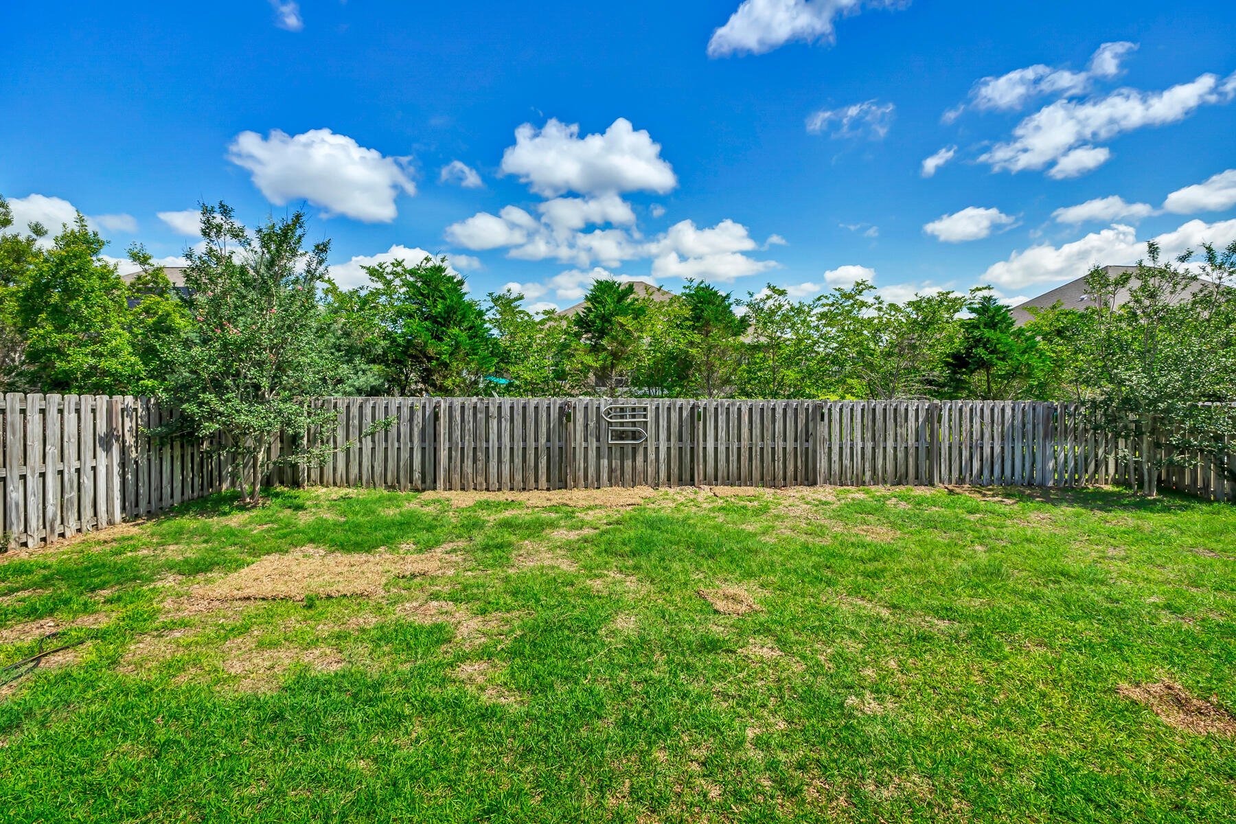 682 Teal Street Crestview, FL 32539 - Photo 29 of 34 a view of a yard with a house