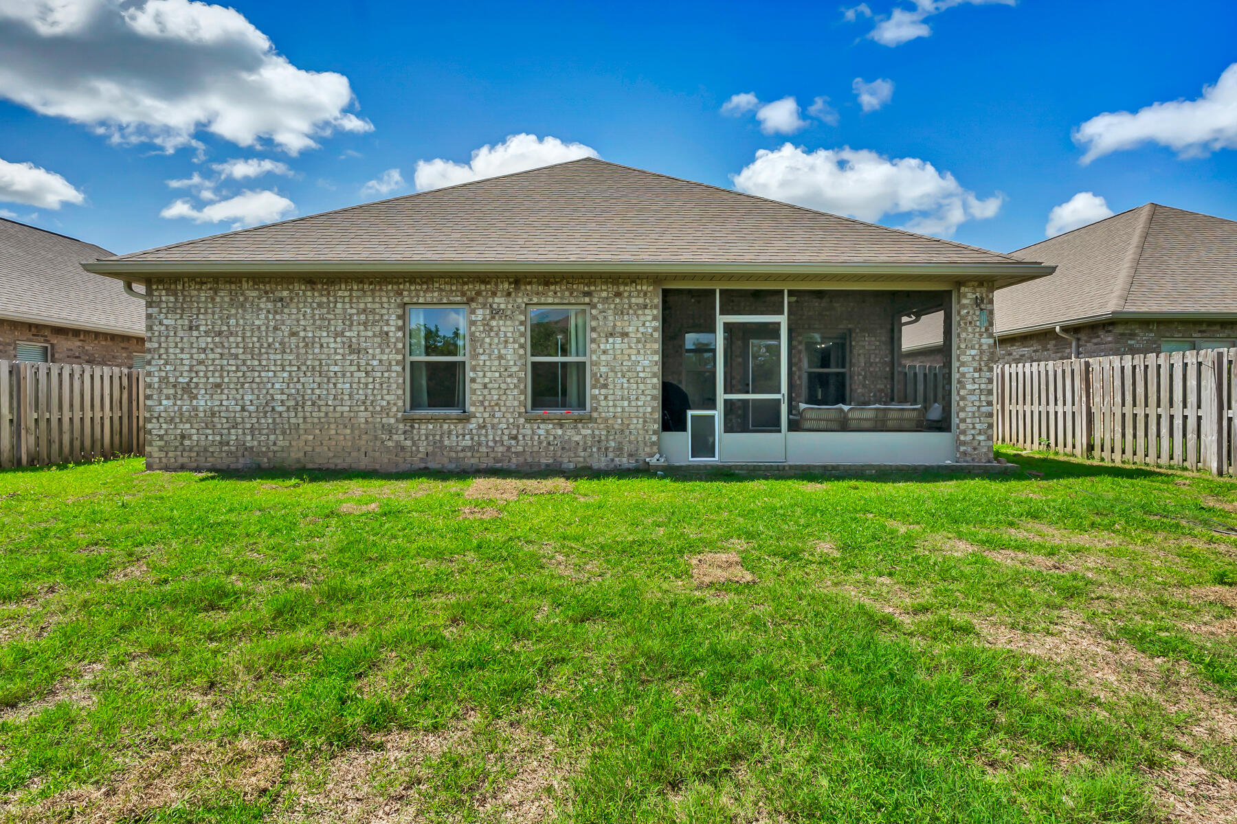 682 Teal Street Crestview, FL 32539 - Photo 31 of 34 a view of a house with a garden