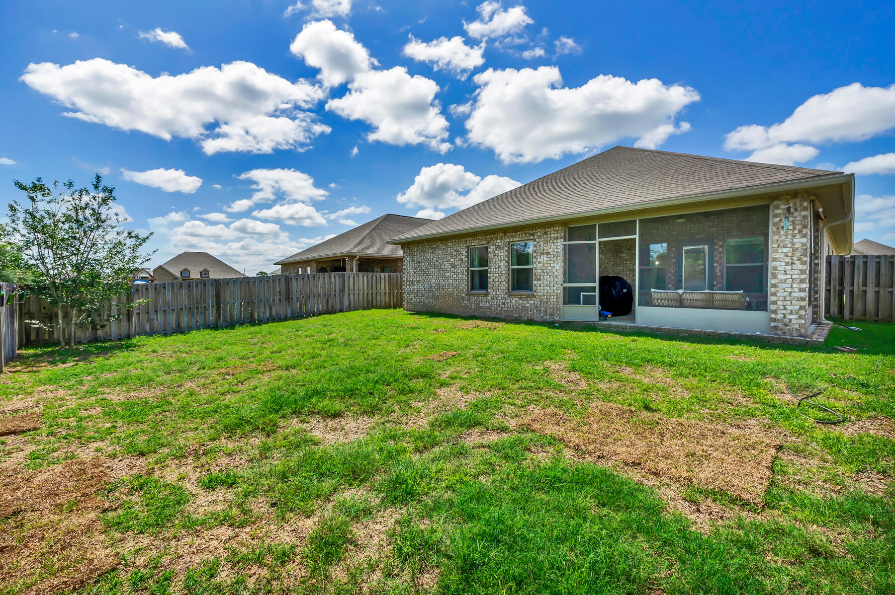 682 Teal Street Crestview, FL 32539 - Photo 34 of 34 a view of a house with a backyard