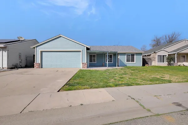 front view of a house with a yard