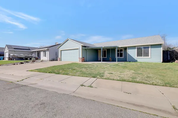 front view of a house with a yard