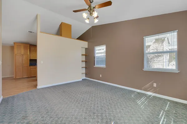 a view of an empty room with a window