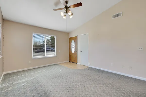 a view of an empty room with a window