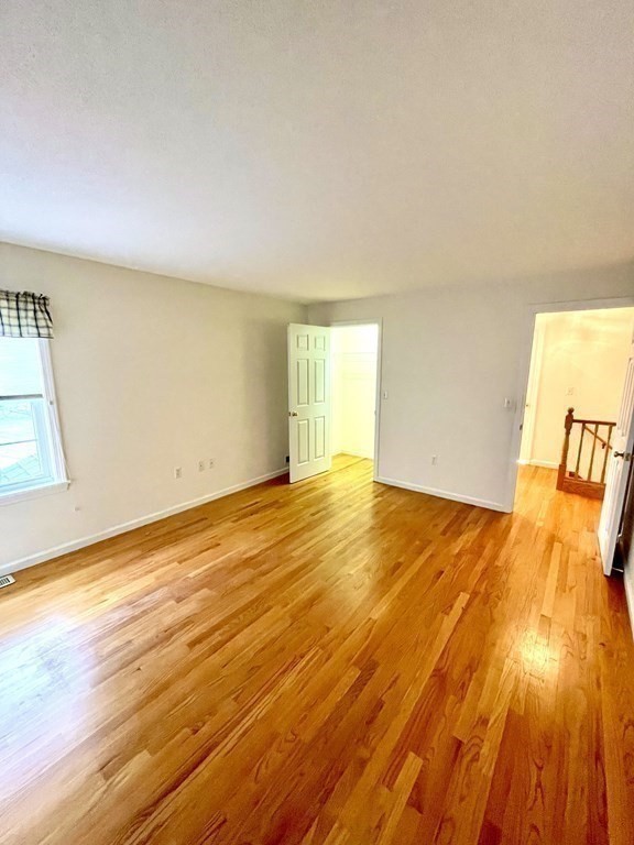 247 Plumtree Road Sunderland, MA 01375 - Photo 21 of 24 wooden floor in an empty room with a window
