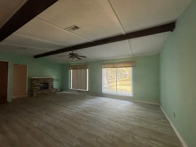 a kitchen with granite countertop a stove and cabinets