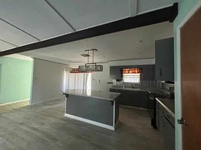 a view of an empty room and a window