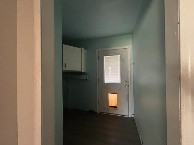 a view of an empty room with windows