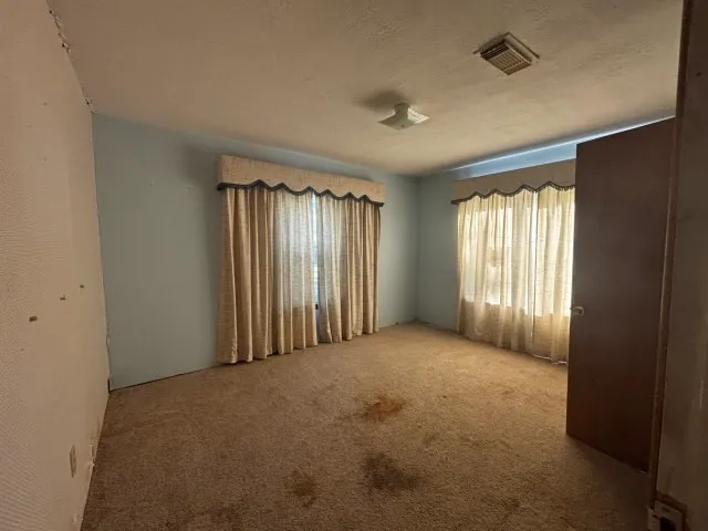 a bathroom with a shower and a sink