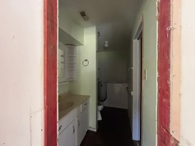 a view of an empty room with a window