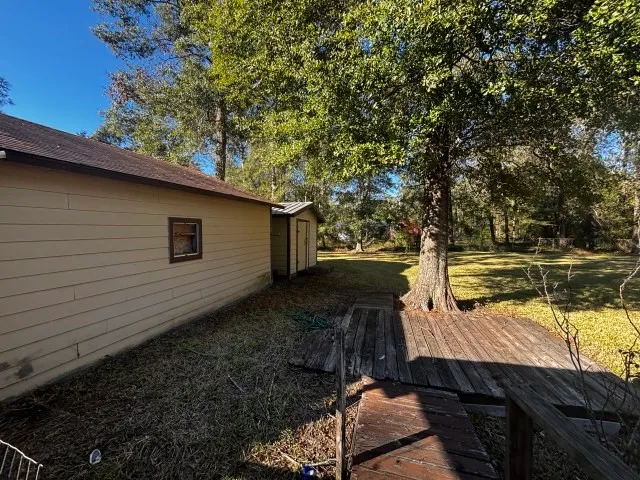 a view of a backyard with a sitting area