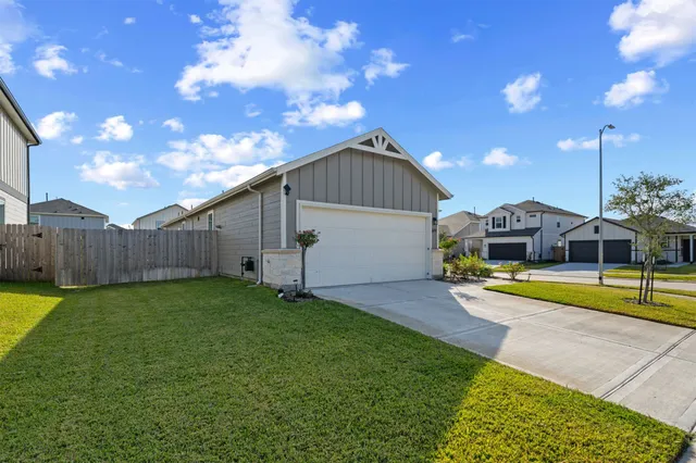 a view of a house with swimming pool and sitting area
