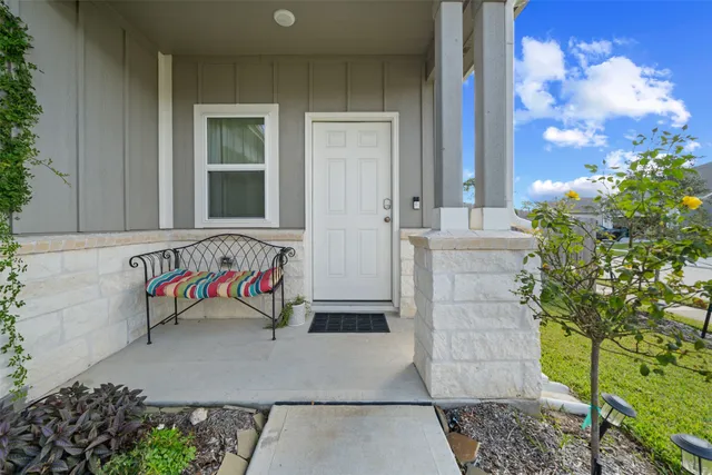 wooden bench sitting in front of a building